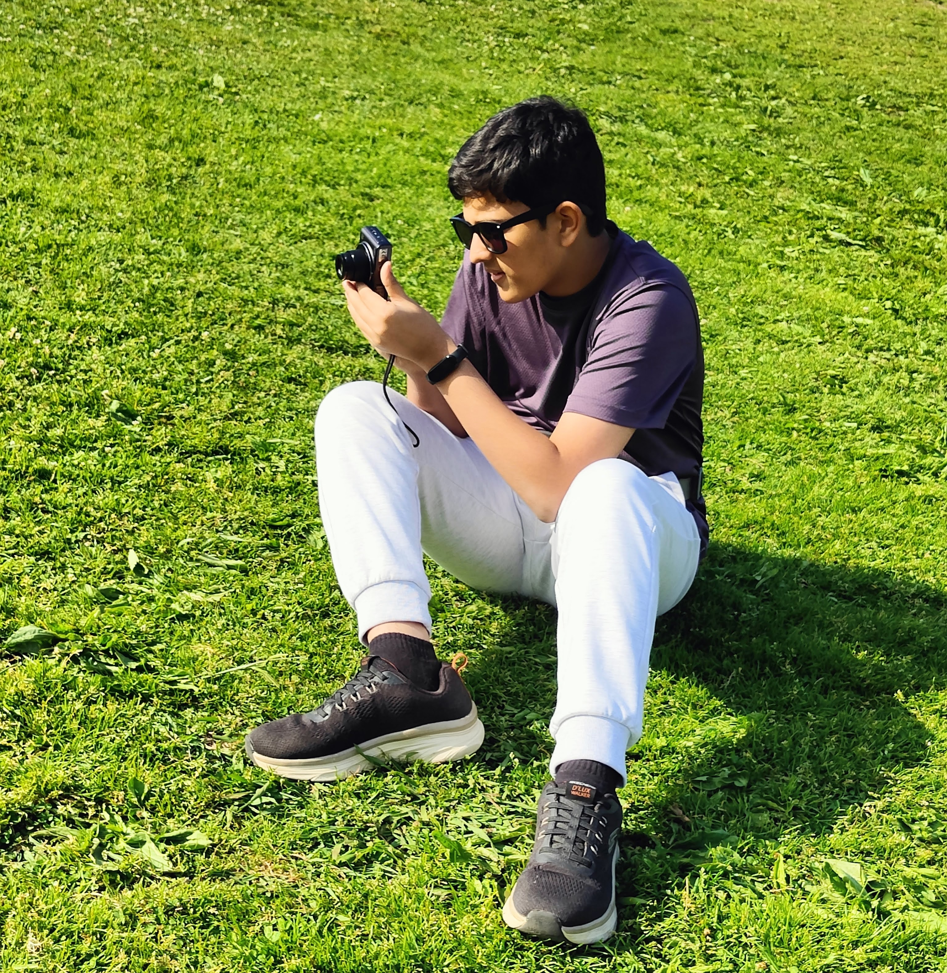 varun sitting on grass